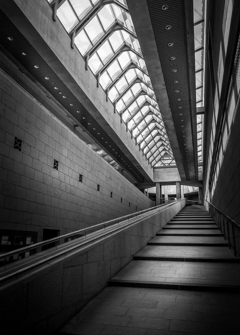 Stair rising toward a skylight