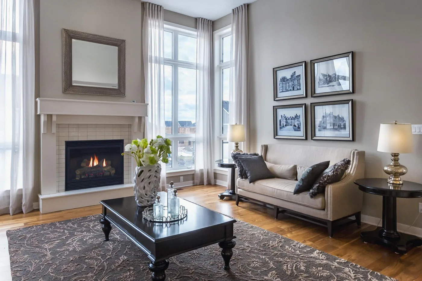 Living room with fireplace and bay windows